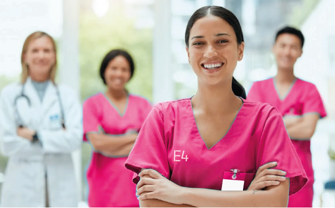 three nurses in pink scrubs